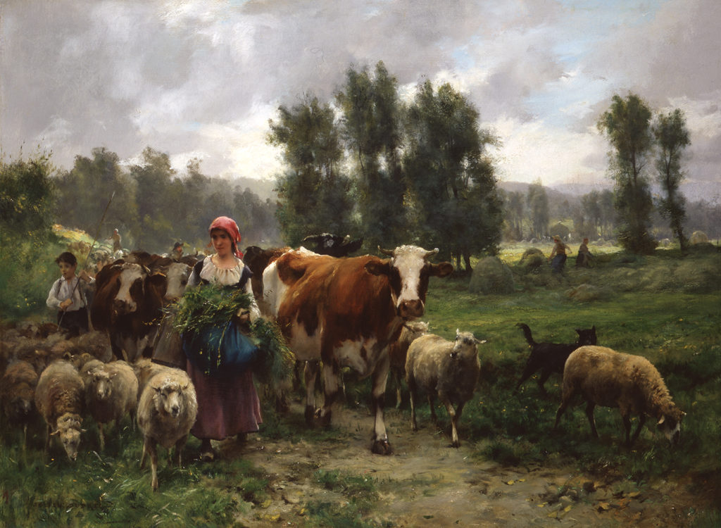 woman and child with cows and sheep