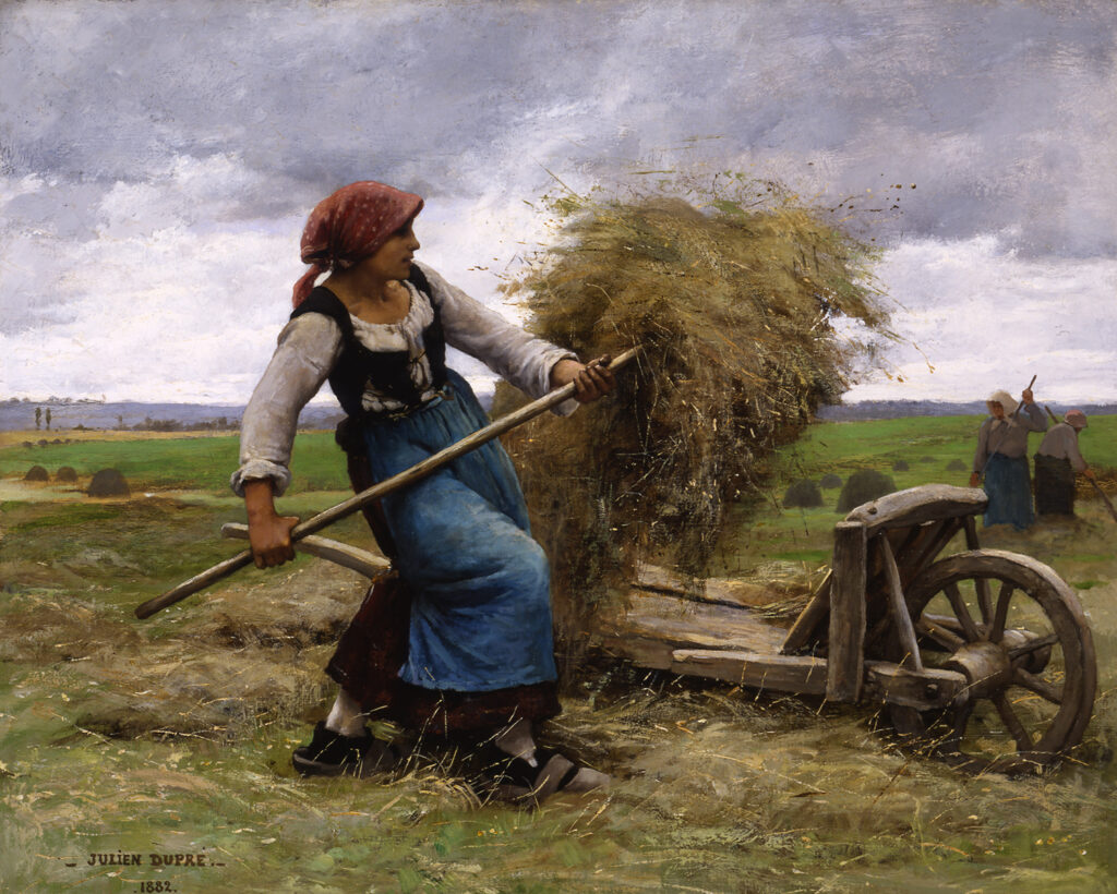 woman pitching hay