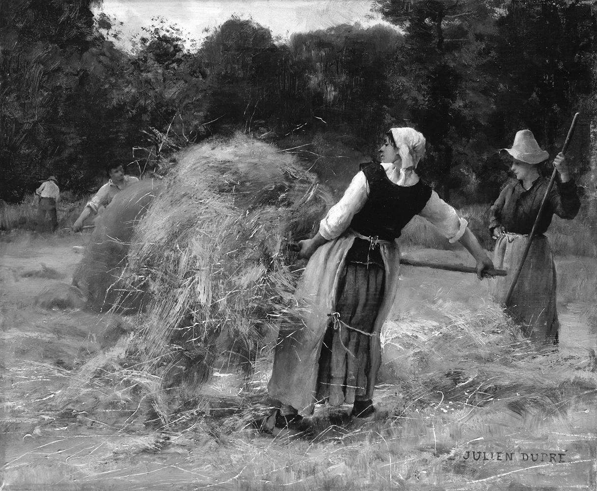woman pitching hay