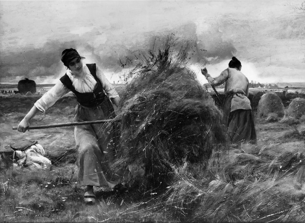 women pitching hay