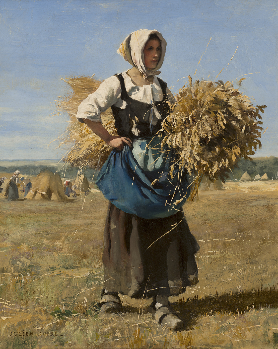 a gleaner walking through the field