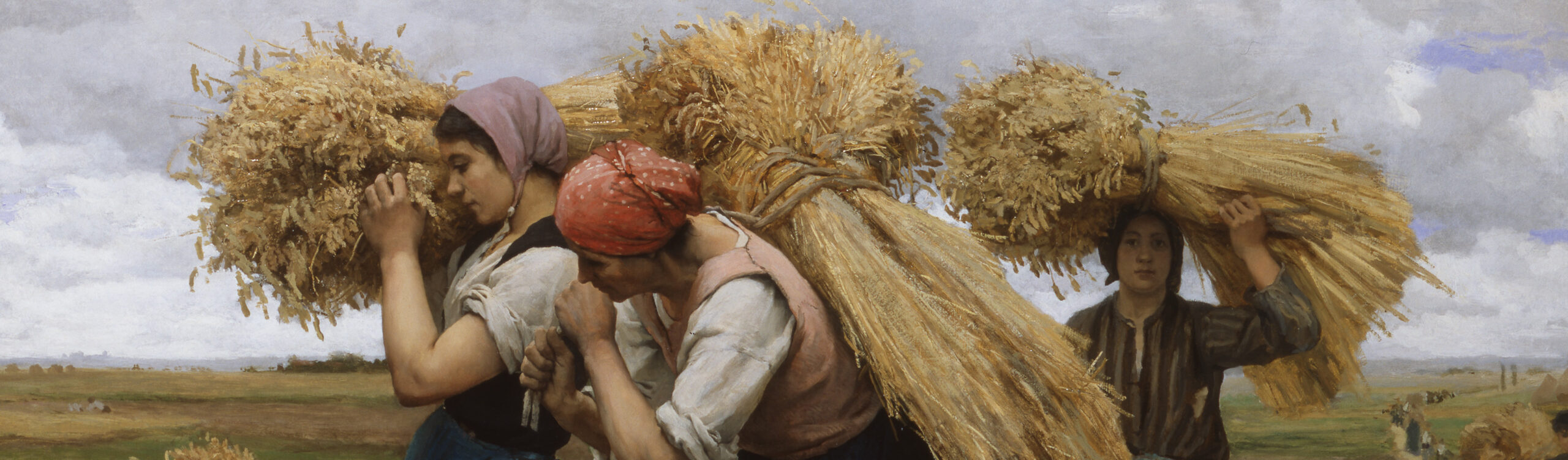 women carrying hay