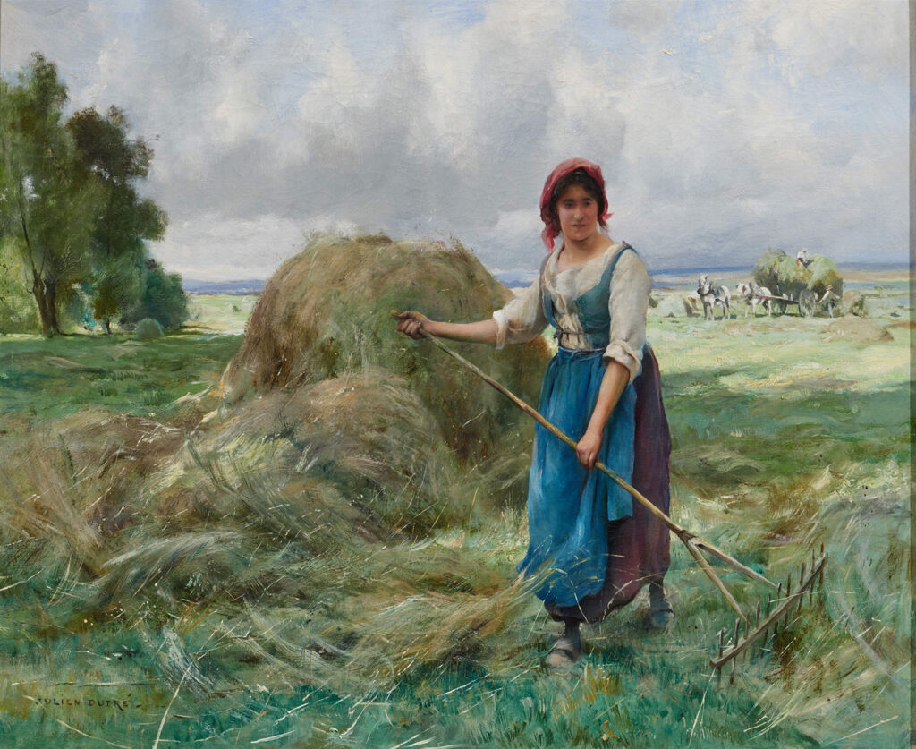 single figure pitching hay